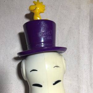 Snoopy wearing spinning top hat with Woodstock Toy